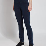 color=Indigo, Angled front view of indigo denim straight leg jean leggings with patented concealing waistband